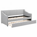 Cama sofá nido tapizada en poliéster gris con cama inferior extraíble y somier de láminas de madera 210 x 98 x 85 cm