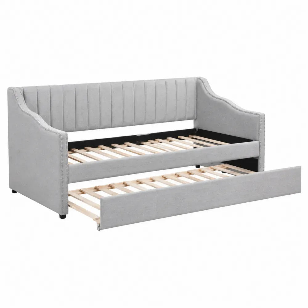 Cama sofá nido tapizada en poliéster gris con cama inferior extraíble y somier de láminas de madera 210 x 98 x 85 cm
